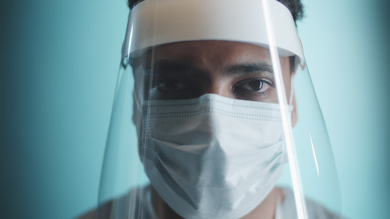 Portrait of Middle Eastern Doctor in Face Shield and Mask