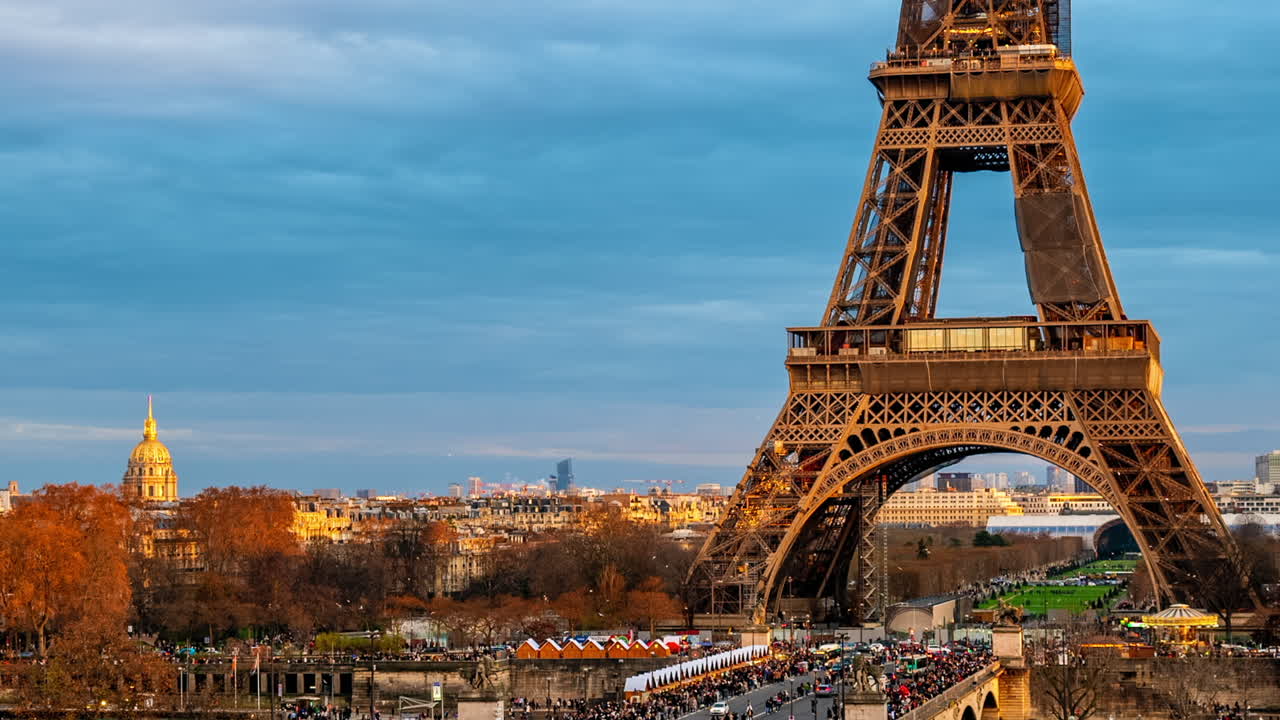 Paris, France - January 4, 2023: Distant view of the Eiffel Tower in Champ de Mars in the evening