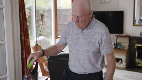 an elderly man with crutches in a living room