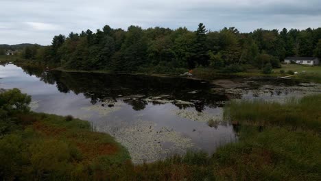 Aerial-push-out-over-Little-Black-Lake-on-a-cloudy-stormy-day