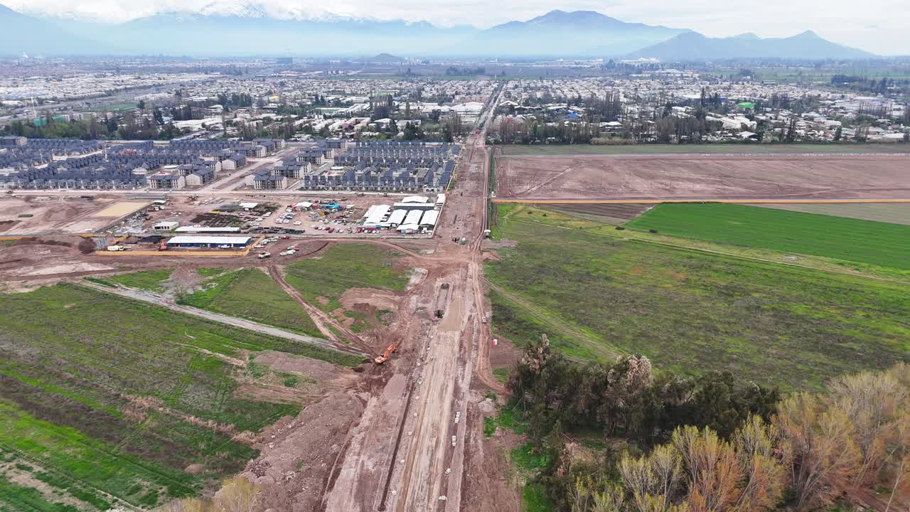 Aerial View of Suburban Construction and Agricultural Fields