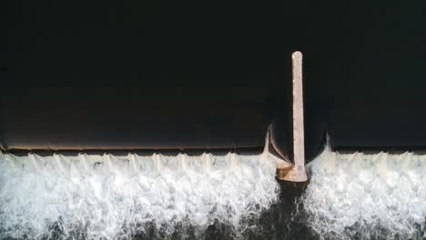 flowing water water mill waterfall at hydroelectric electric power plant, aerial top down