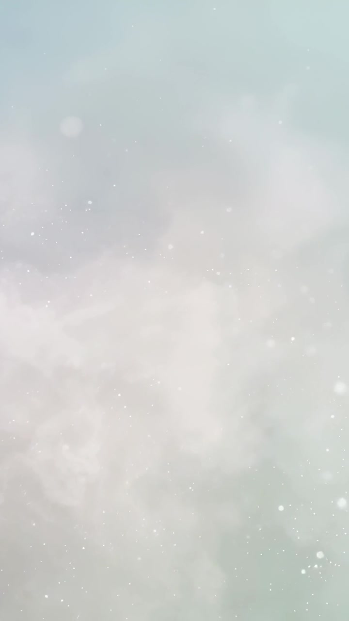 Video verticale: Leggero spostamento di luce, nebbia e punti luminosi che fluttuano su uno sfondo pastello per la calma.
