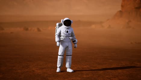 astronauta en la superficie de marte. planeta rojo cubierto de gas y roca