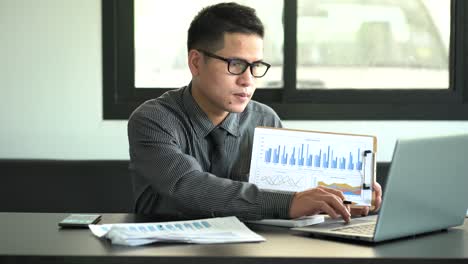 calculations with business documents policy and plan analysts are analyzing data from graphs to improve performance. business concept and education