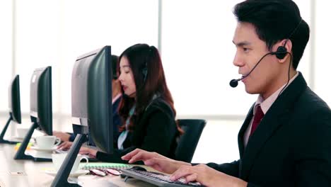 business people wearing headset working in office