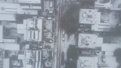 top down view of snow covered street in suburban neighborhood