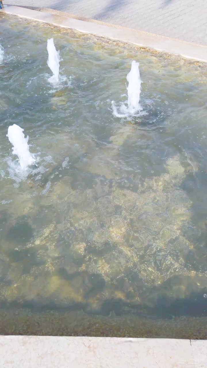 A fountain with water shooting out of it