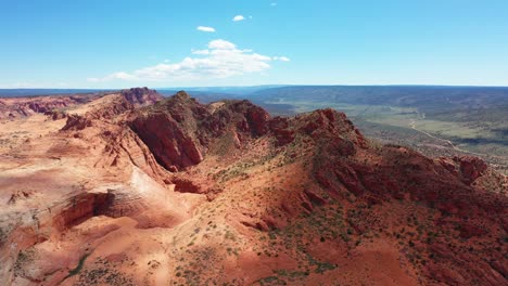 cinematic drone shot , aerial view of the rugged cliffs and desert landscape