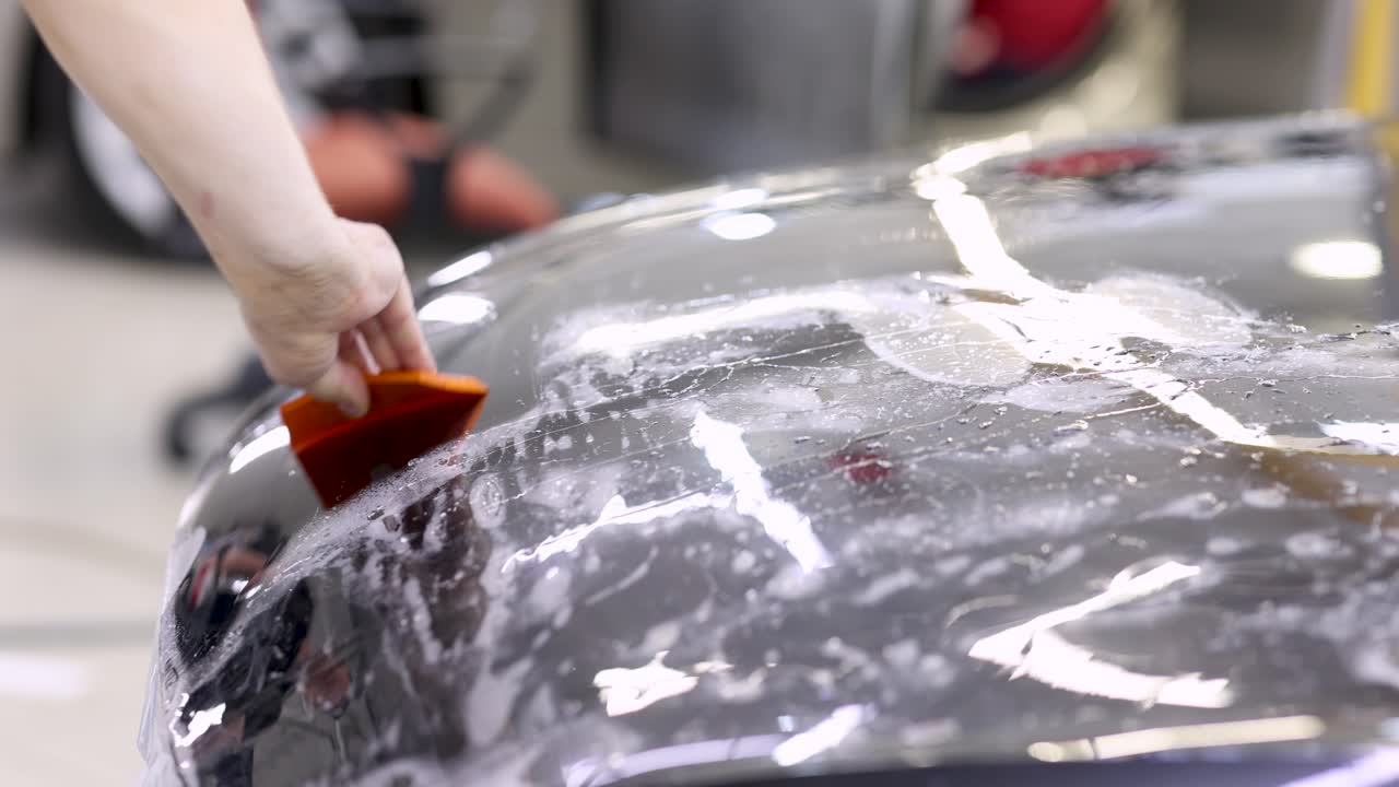 Applying Paint Protection Film to a Car Hood