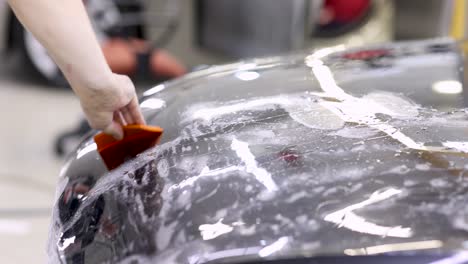 applying paint protection film to a car hood