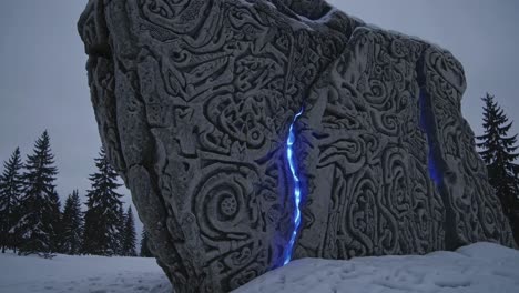 illuminated carved stone in winter forest