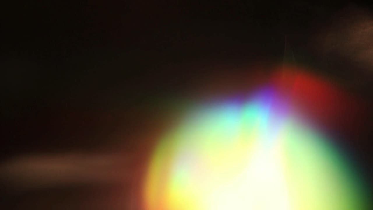 Abstract Rainbow Light Leaks and Lens Flares on Black Background