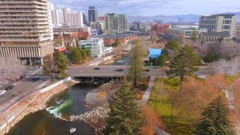 aerial over the truckee river in reno, nevada with cars passing by on the overpass