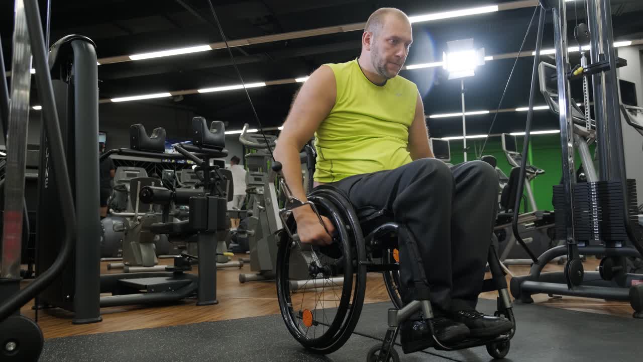 Man with disabilities training in the gym of rehabilitation center