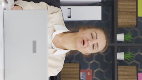 Vertical-video-of-Business-woman-finishing-her-work-and-relaxing.