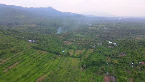 Beautiful-Rural-Landscape-With-Structures-And-Forest-Hills-During-Misty-Morning-In-West-Bali,-Indonesia