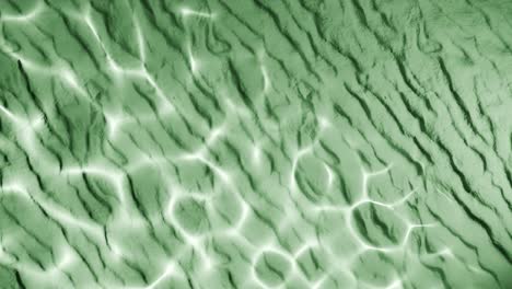 water reflection light pattern on wrinkled green sand surface. abstract natural overlay with wavy lines and sunlight ripple effect. design for wallpaper, banner, postcard, greeting card, poster,