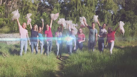 Video-De-Luces-Sobre-Un-Grupo-Diverso-De-Voluntarios-Que-Aplauden-Recogiendo-Basura-En-El-Campo