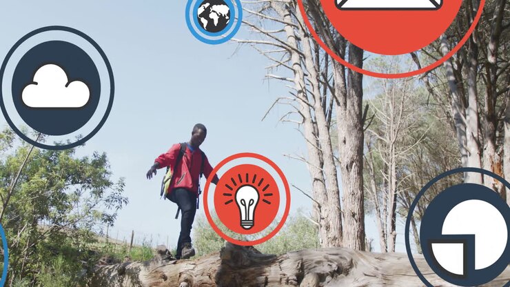 Animation of icon in circles over african american man wearing mask walking on fallen tree