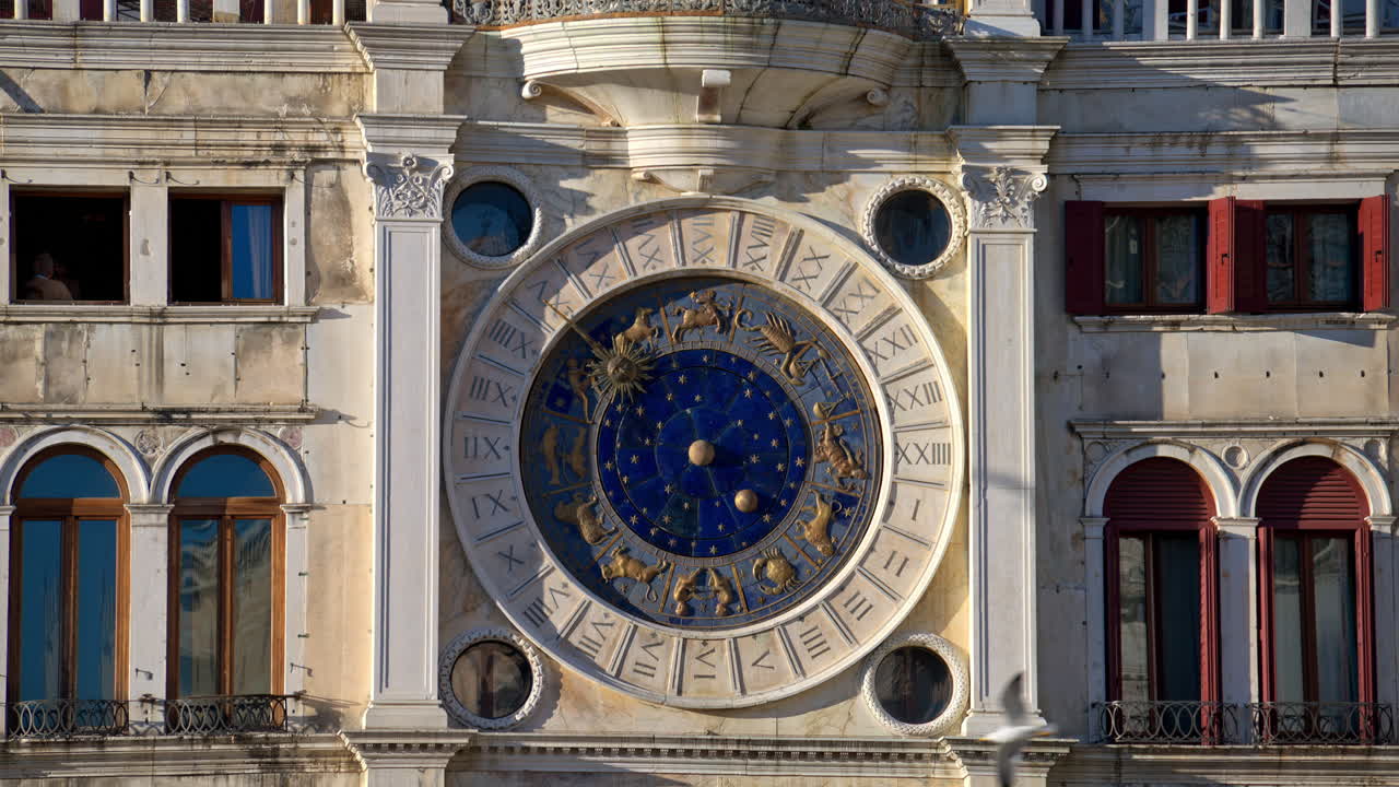 Close up view of the facade of The Clock Tower in St. Mark's Square in Venice, Italy