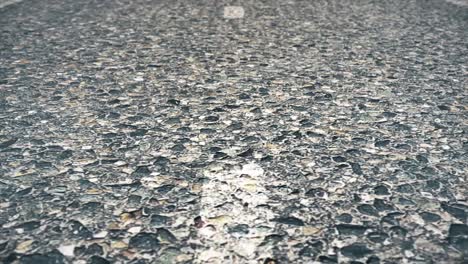close-up view of a road surface with a white line