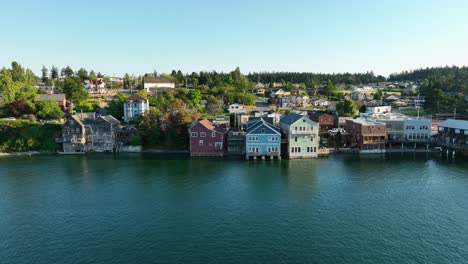 aerial shot pushing towards coupeville shops hanging out over the historic waterfront