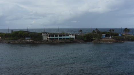 low-level aerial view of isla de cabra in puerto rico a former leper colony and military fortification