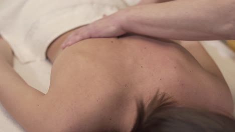 peaceful woman enjoying a back massage