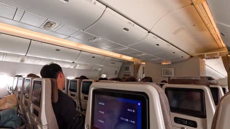 passengers seated inside an airplane cabin