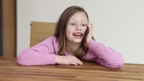 Young girl talking on a smartphone