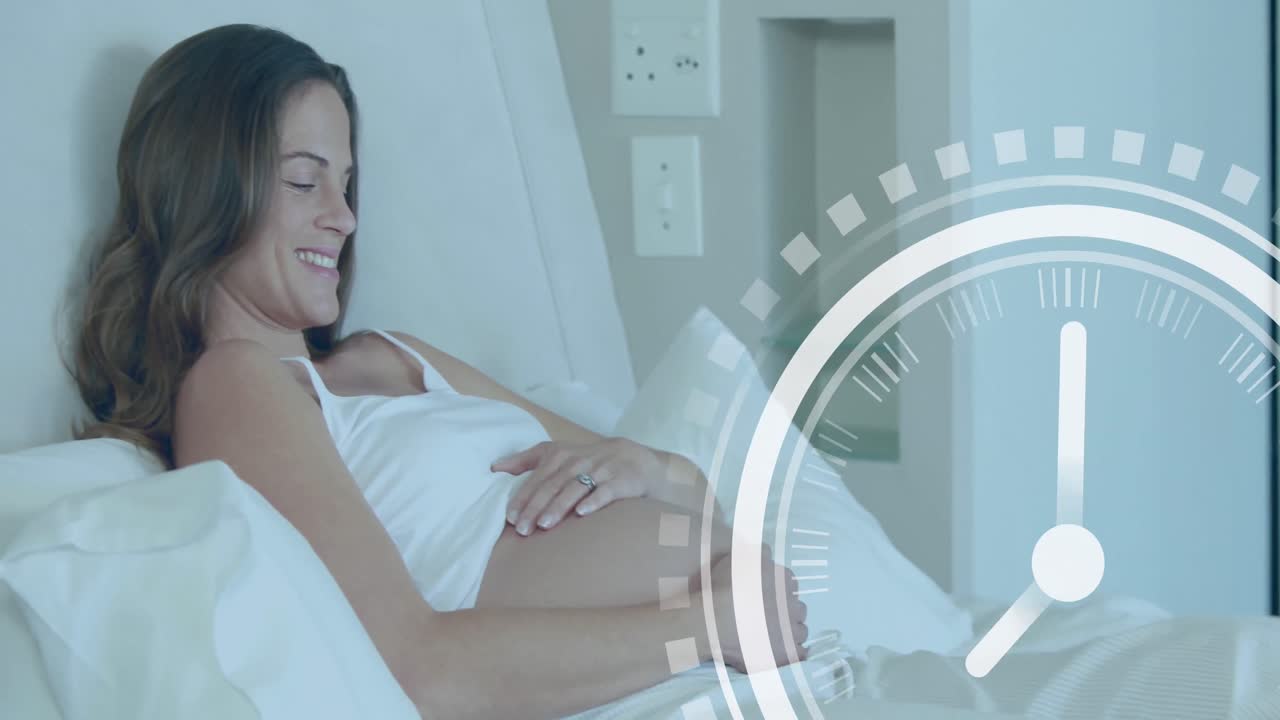 Clock with fast moving hands over happy pregnant caucasian woman lying on bed holding belly