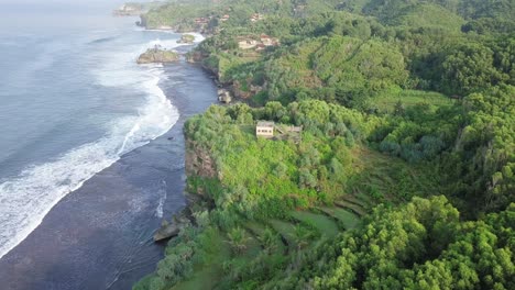 a building on the top of cliff border with the sea