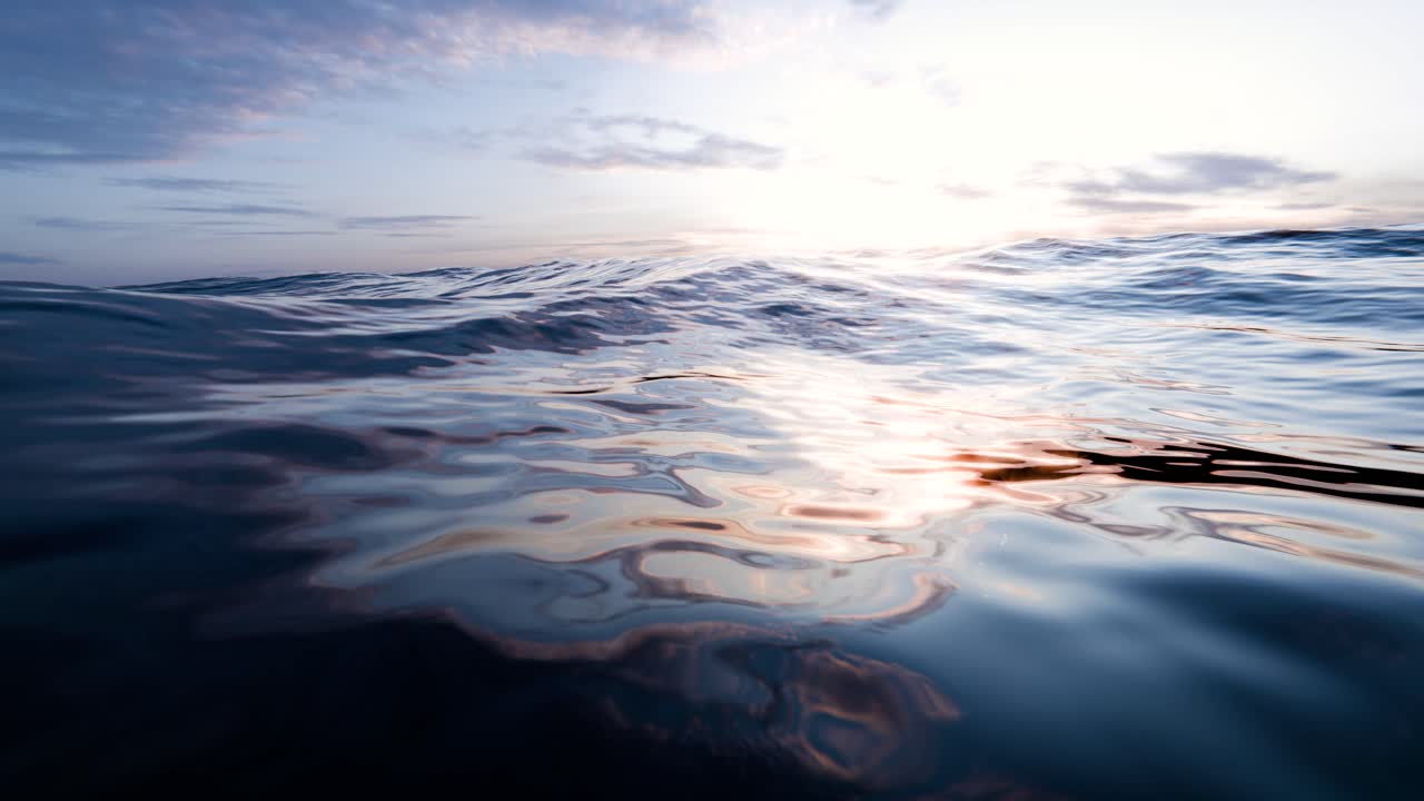 Vista ravvicinata di onde oceaniche che riflettono la luce solare sulla superficie.