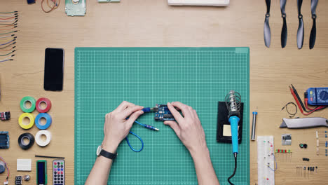 top view software engineer hands coding  at desk from above - red epic dragon