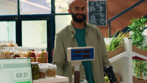 merchant using scale at checkout