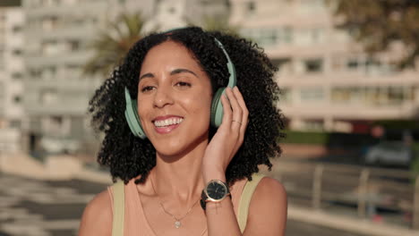 black woman, headphones and listening to music