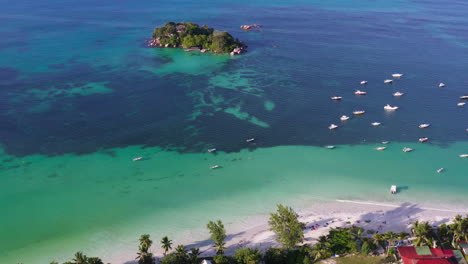 a tiny island lies across cote d'or beach in praslin