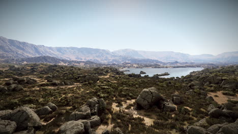 a scenic view of a lake in a mountain valley