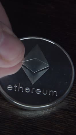 ethereum coin cryptocurrency on wooden table