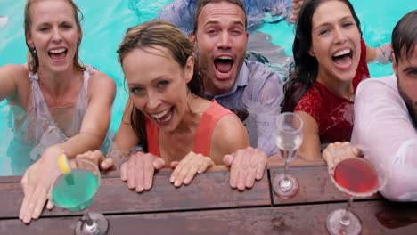 friends having a drink in the swimming pool