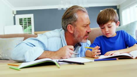 Father-helping-boy-with-homework