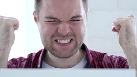 frustrated young man reacting to financial problem