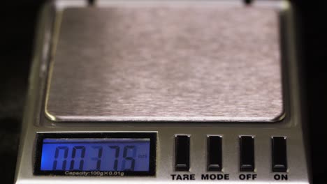 weighing a small object on a digital scale