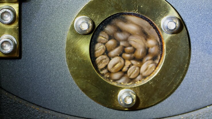 Roasted Coffee Beans In Modern Machine
