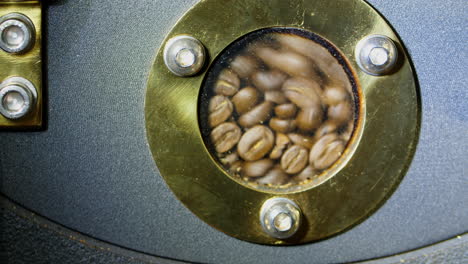 roasted coffee beans in modern machine