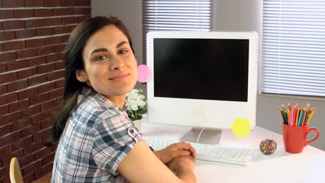 Portrait-of-smiling-business-executive-working-on-computer