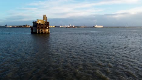 Aerial-shot-flying-towards-a-dilapidated-WOII-war-fort-in-the-Isle-of-Grain,-United-Kingdom