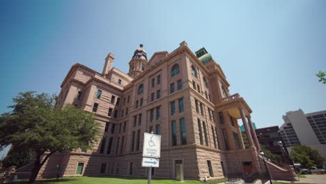 Low-angle-wide-angle-shot-of-the-Tarrant-County-Courthouse-in-Fort-Worth,-Texas