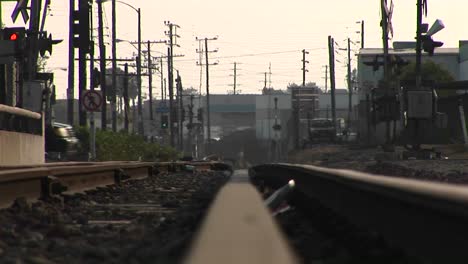 Cars-drive-over-a-railroad-track